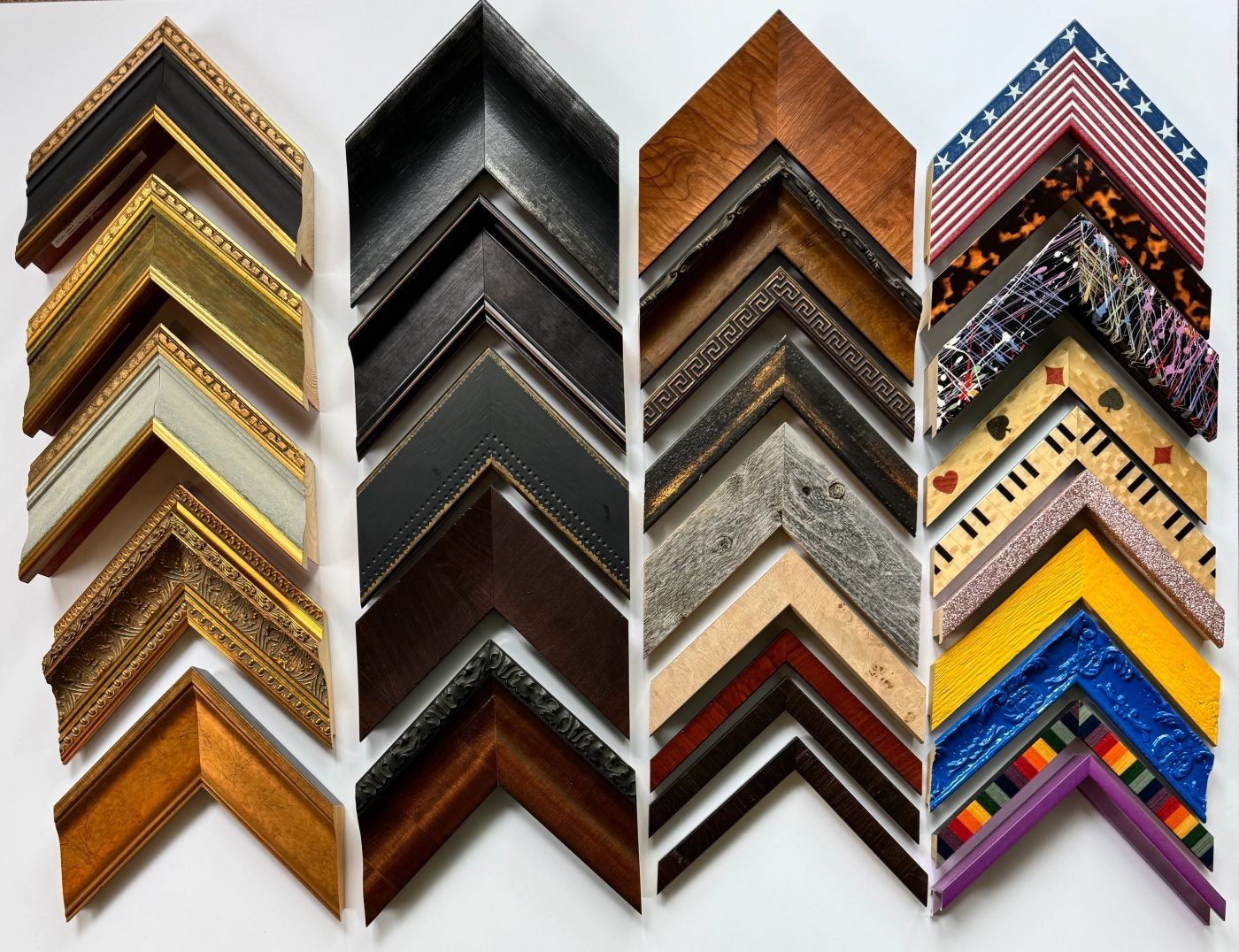 The sample wall: Gold, black, wood, rustic and bright painted mouldings.