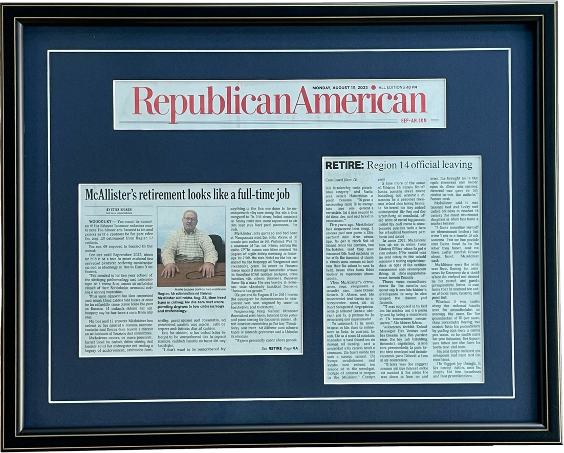 A newspaper feature: Masthead and two clippings, double matted in navy and white.