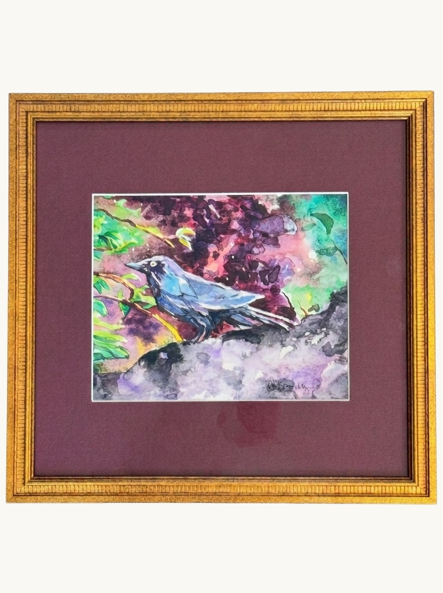 A signed watercolor of a bird among lilacs, matted in burgundy in a gold frame